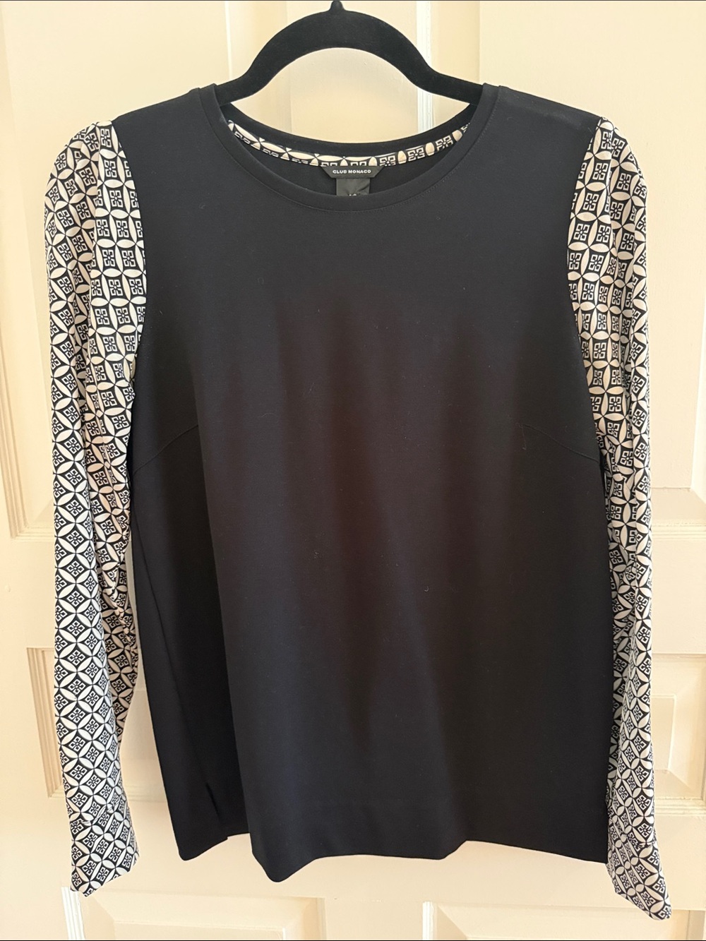Club Monaco Black Top with Monochrome Patterned Sleeves